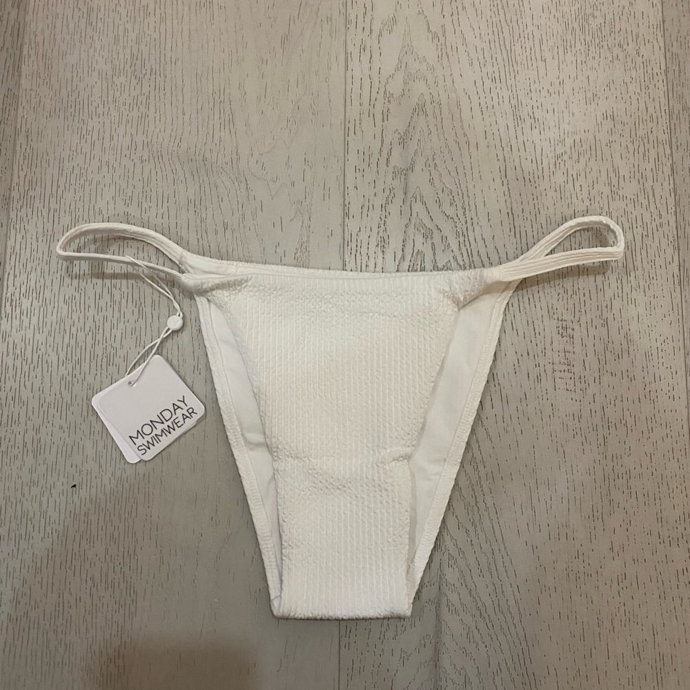 Monday swimwear bikini bottom in color white. Size large. Has never been worn.